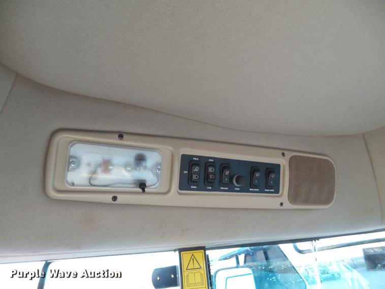 image for item BJ9798 2014 MacDon M205 self-propelled windrower