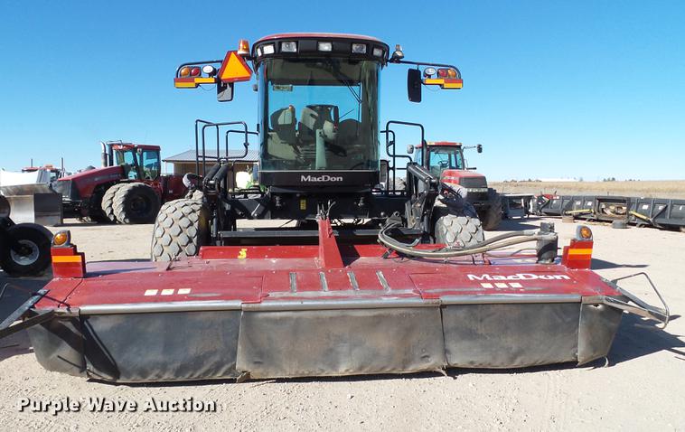 image for item BJ9799 2015 MacDon M205 self-propelled windrower