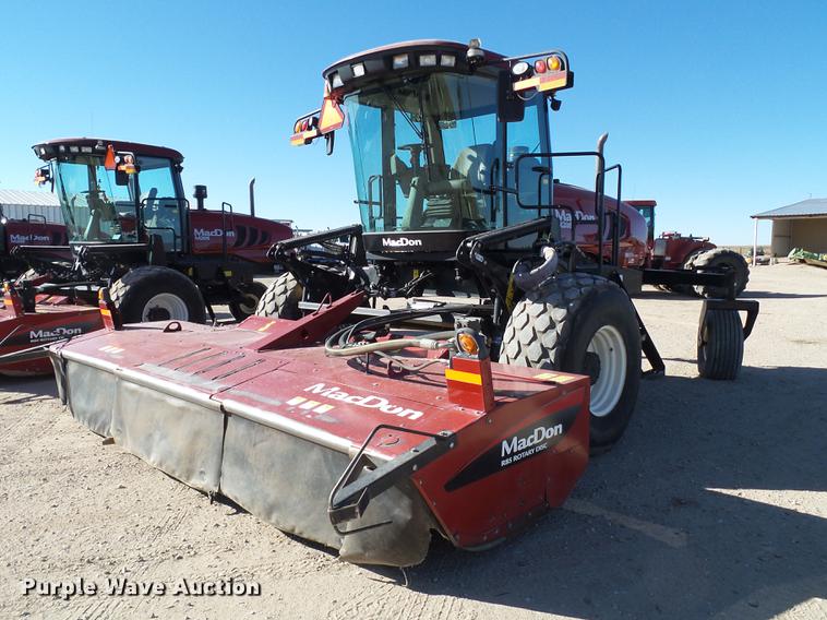 image for item BJ9799 2015 MacDon M205 self-propelled windrower