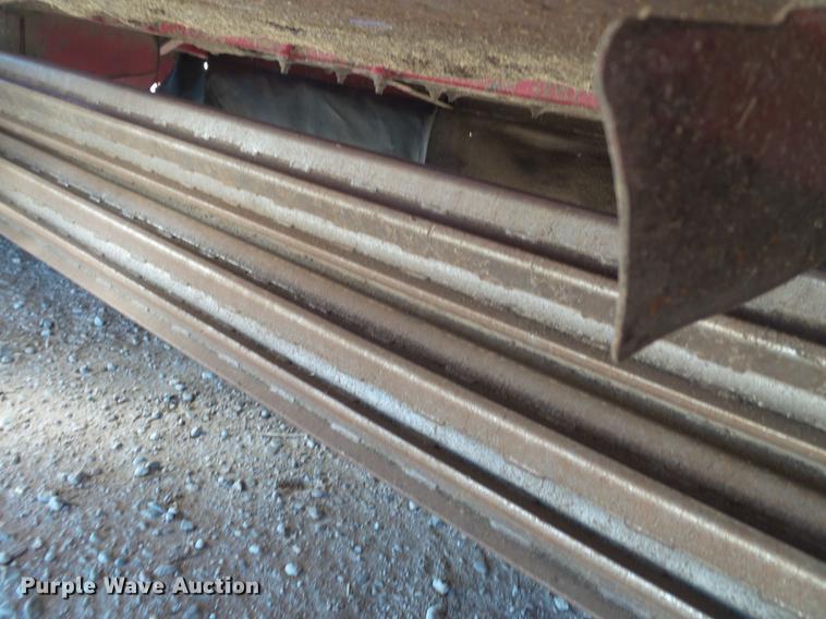 image for item BJ9799 2015 MacDon M205 self-propelled windrower