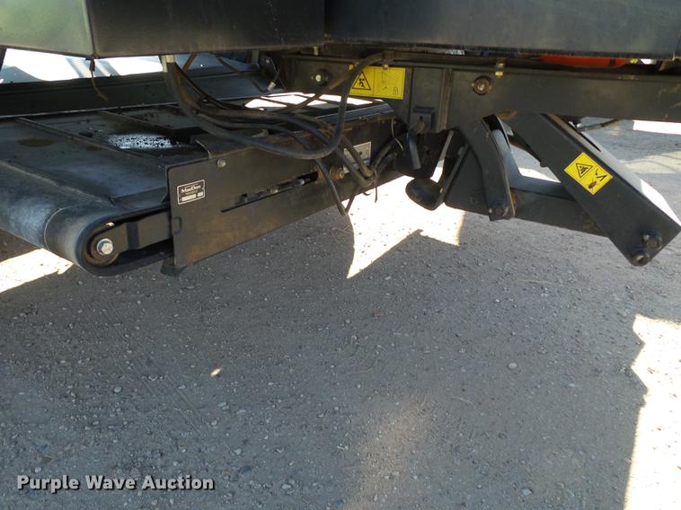 image for item BJ9799 2015 MacDon M205 self-propelled windrower