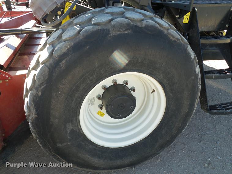 image for item BJ9799 2015 MacDon M205 self-propelled windrower