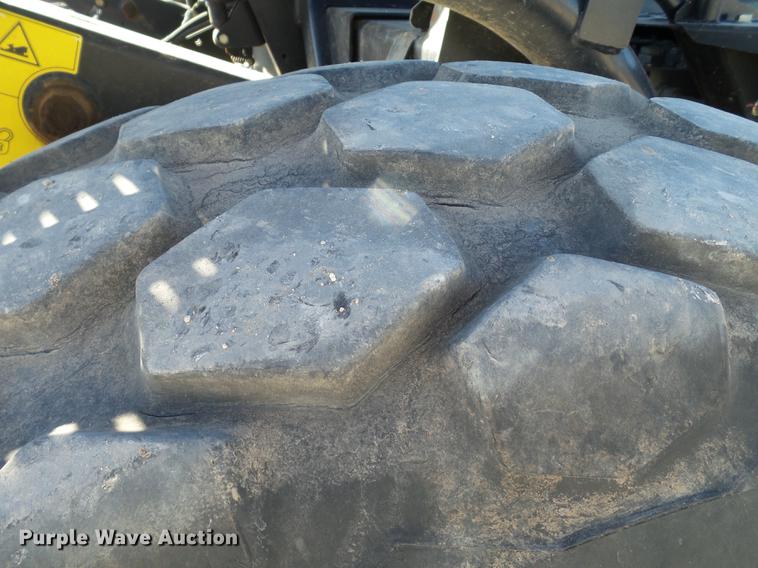 image for item BJ9799 2015 MacDon M205 self-propelled windrower