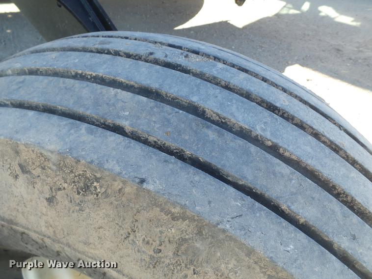 image for item BJ9799 2015 MacDon M205 self-propelled windrower