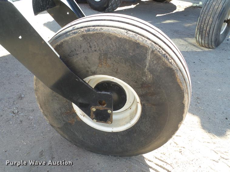 image for item BJ9799 2015 MacDon M205 self-propelled windrower