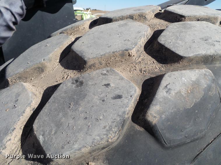 image for item BJ9799 2015 MacDon M205 self-propelled windrower