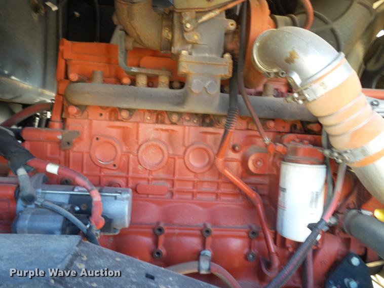 image for item BJ9799 2015 MacDon M205 self-propelled windrower