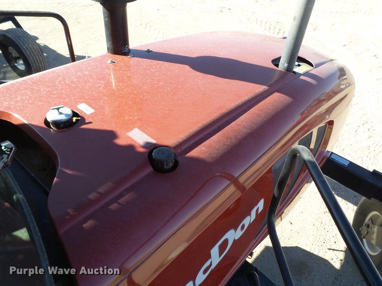 image for item BJ9799 2015 MacDon M205 self-propelled windrower