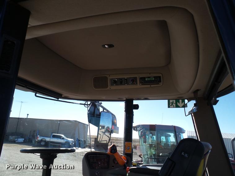 image for item BJ9799 2015 MacDon M205 self-propelled windrower