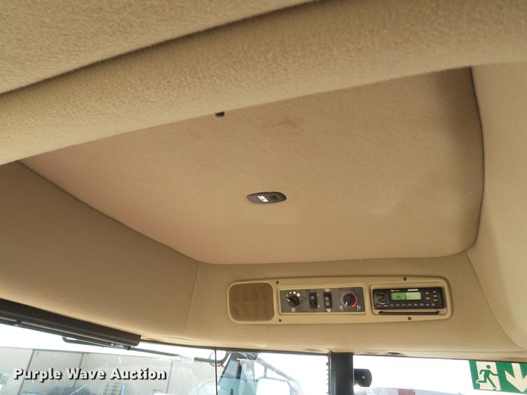 image for item BJ9799 2015 MacDon M205 self-propelled windrower