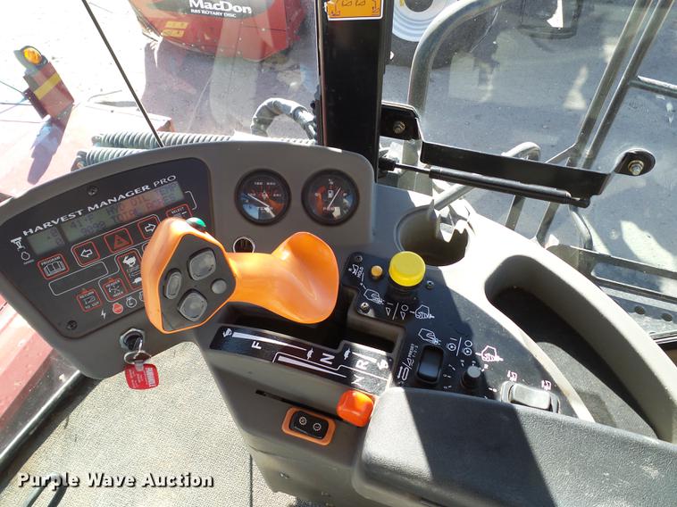 image for item BJ9799 2015 MacDon M205 self-propelled windrower