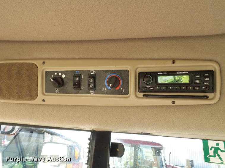 image for item BJ9799 2015 MacDon M205 self-propelled windrower