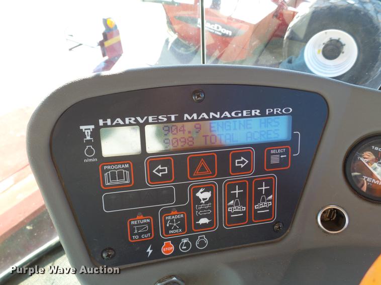 image for item BJ9799 2015 MacDon M205 self-propelled windrower