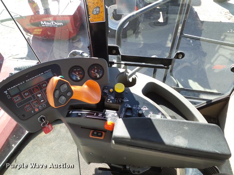 image for item BJ9799 2015 MacDon M205 self-propelled windrower