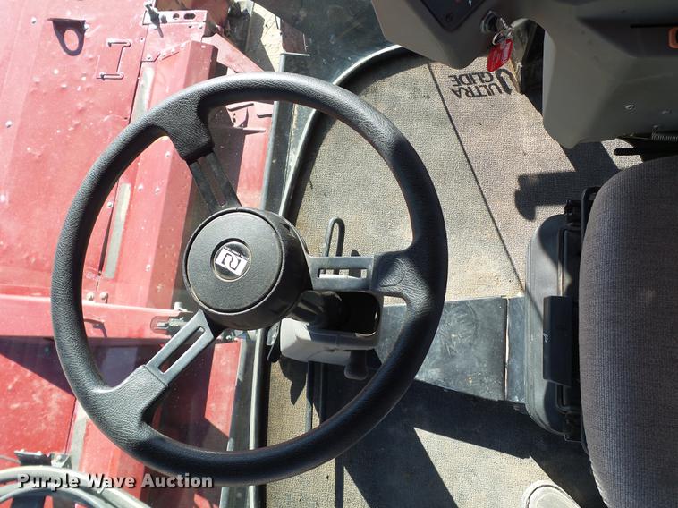 image for item BJ9799 2015 MacDon M205 self-propelled windrower