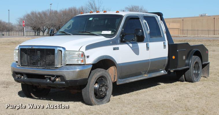 image for item DB5095 1999 Ford F450 Super Duty XLT Crew Cab flatbed truck