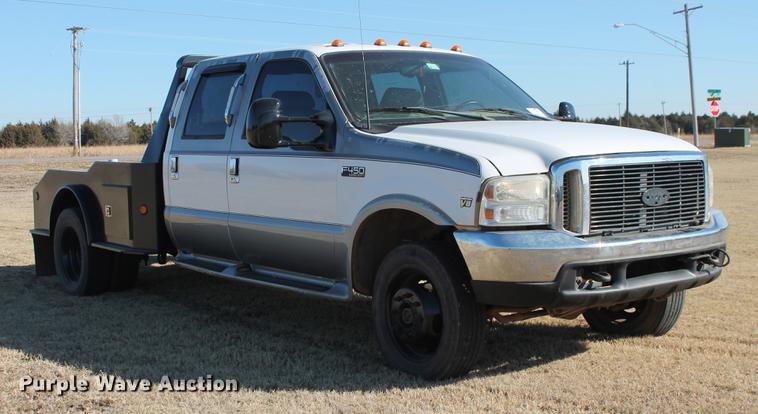 image for item DB5095 1999 Ford F450 Super Duty XLT Crew Cab flatbed truck