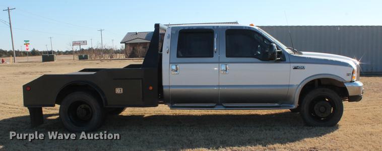 image for item DB5095 1999 Ford F450 Super Duty XLT Crew Cab flatbed truck