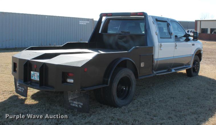 image for item DB5095 1999 Ford F450 Super Duty XLT Crew Cab flatbed truck