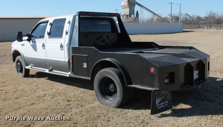 image for item DB5095 1999 Ford F450 Super Duty XLT Crew Cab flatbed truck