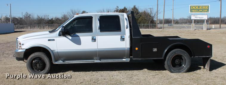 image for item DB5095 1999 Ford F450 Super Duty XLT Crew Cab flatbed truck