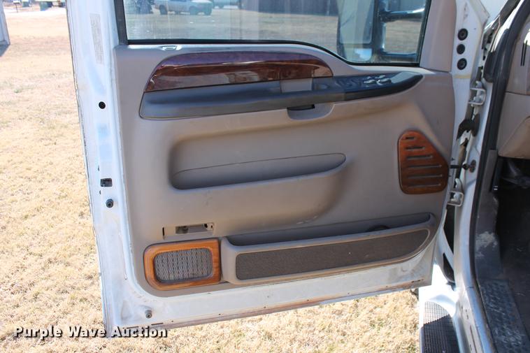 image for item DB5095 1999 Ford F450 Super Duty XLT Crew Cab flatbed truck