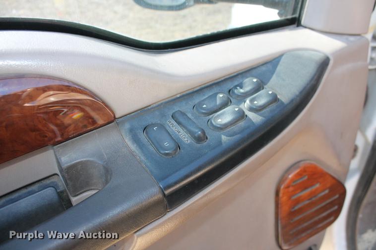 image for item DB5095 1999 Ford F450 Super Duty XLT Crew Cab flatbed truck