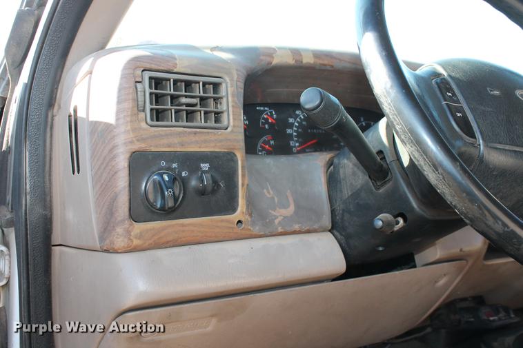 image for item DB5095 1999 Ford F450 Super Duty XLT Crew Cab flatbed truck