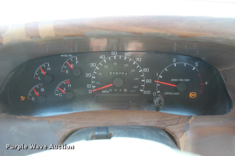 image for item DB5095 1999 Ford F450 Super Duty XLT Crew Cab flatbed truck