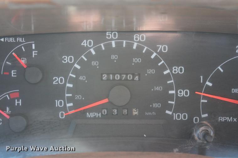 image for item DB5095 1999 Ford F450 Super Duty XLT Crew Cab flatbed truck