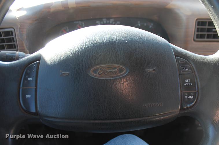 image for item DB5095 1999 Ford F450 Super Duty XLT Crew Cab flatbed truck