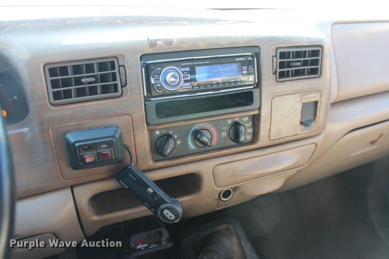 image for item DB5095 1999 Ford F450 Super Duty XLT Crew Cab flatbed truck