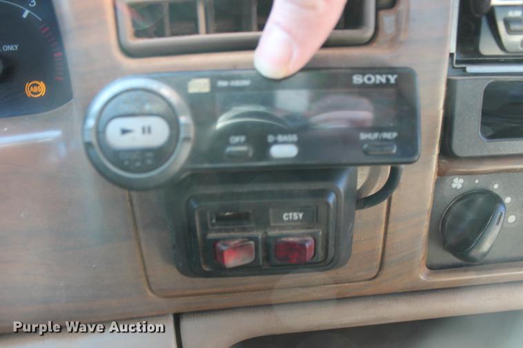 image for item DB5095 1999 Ford F450 Super Duty XLT Crew Cab flatbed truck