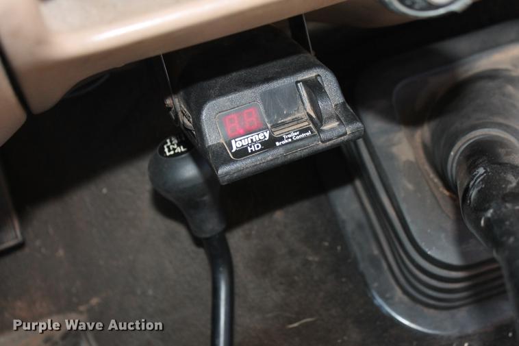 image for item DB5095 1999 Ford F450 Super Duty XLT Crew Cab flatbed truck