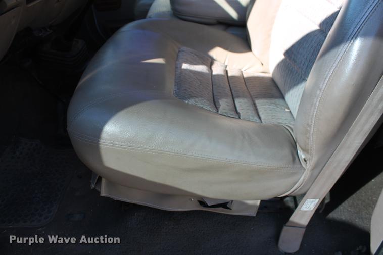 image for item DB5095 1999 Ford F450 Super Duty XLT Crew Cab flatbed truck