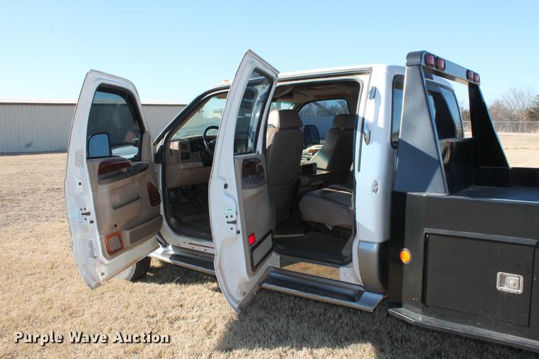 image for item DB5095 1999 Ford F450 Super Duty XLT Crew Cab flatbed truck