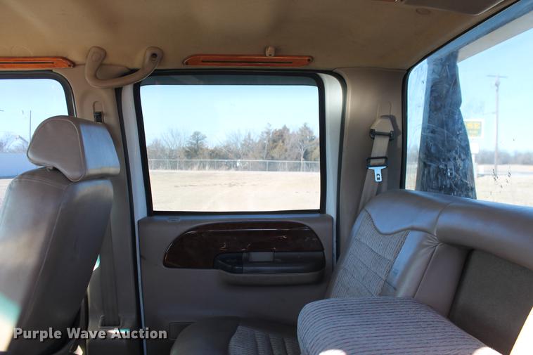 image for item DB5095 1999 Ford F450 Super Duty XLT Crew Cab flatbed truck