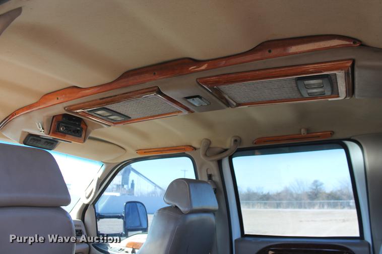 image for item DB5095 1999 Ford F450 Super Duty XLT Crew Cab flatbed truck