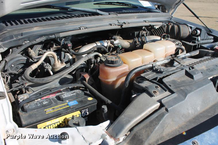 image for item DB5095 1999 Ford F450 Super Duty XLT Crew Cab flatbed truck