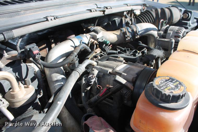 image for item DB5095 1999 Ford F450 Super Duty XLT Crew Cab flatbed truck