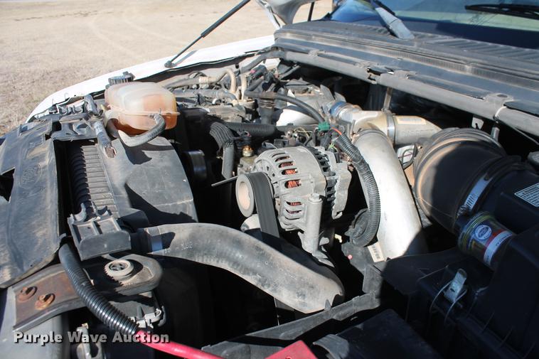 image for item DB5095 1999 Ford F450 Super Duty XLT Crew Cab flatbed truck