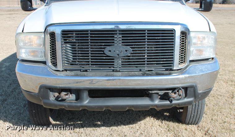 image for item DB5095 1999 Ford F450 Super Duty XLT Crew Cab flatbed truck