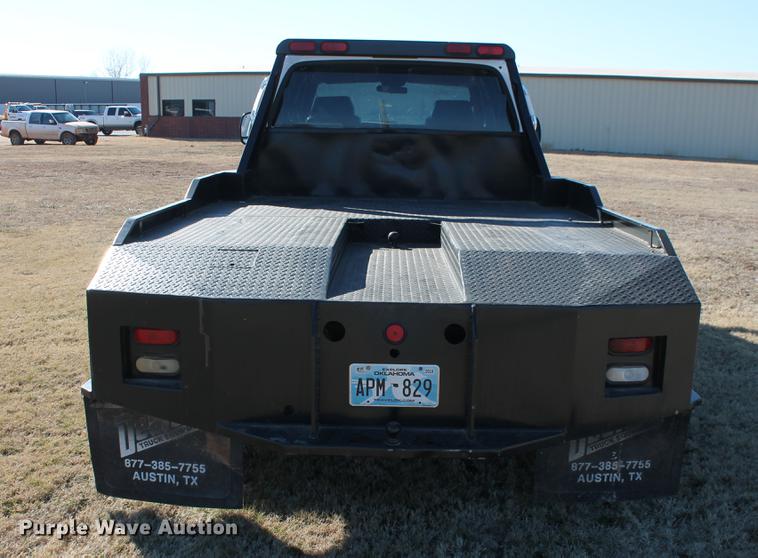 image for item DB5095 1999 Ford F450 Super Duty XLT Crew Cab flatbed truck
