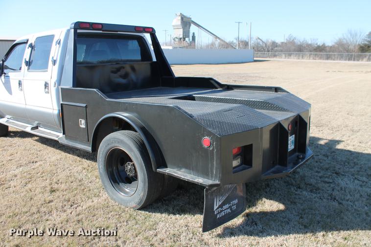 image for item DB5095 1999 Ford F450 Super Duty XLT Crew Cab flatbed truck