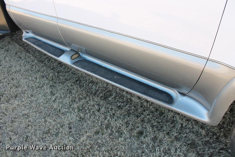 image for item DB5095 1999 Ford F450 Super Duty XLT Crew Cab flatbed truck