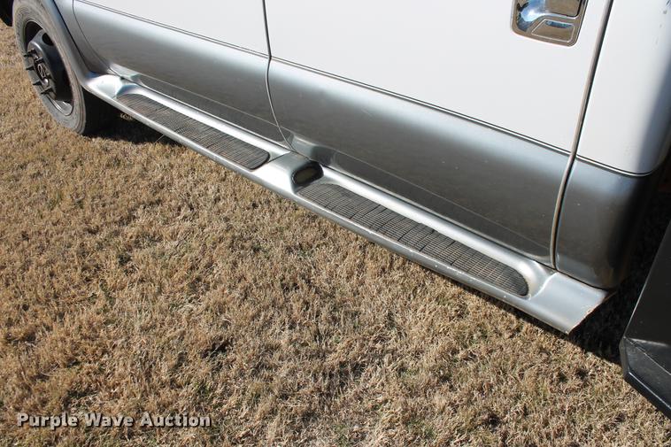 image for item DB5095 1999 Ford F450 Super Duty XLT Crew Cab flatbed truck