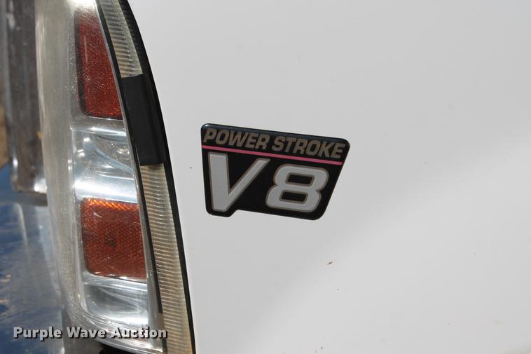 image for item DB5095 1999 Ford F450 Super Duty XLT Crew Cab flatbed truck