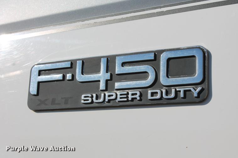 image for item DB5095 1999 Ford F450 Super Duty XLT Crew Cab flatbed truck