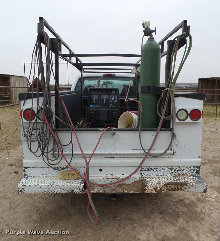 image for item EI9531 2000 Ford F250 Super Duty utility bed pickup truck