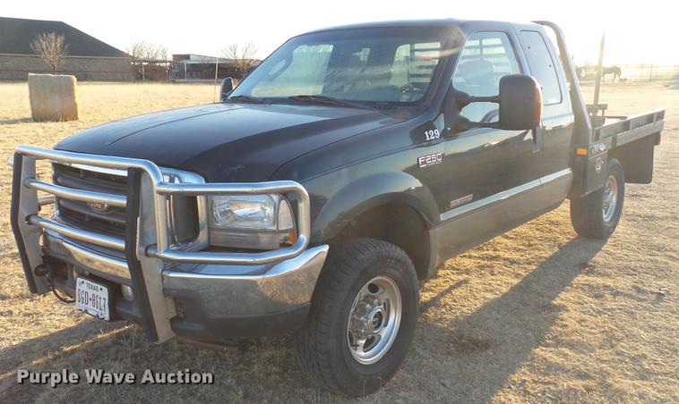 image for item EI9541 2004 Ford F250 Super Duty SuperCab bale bed pickup truck